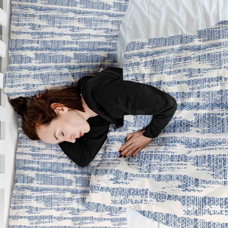 Therapy blanket and bedding set with blue pattern.
