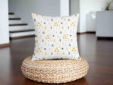Health pillow, white with yellow triangles.
