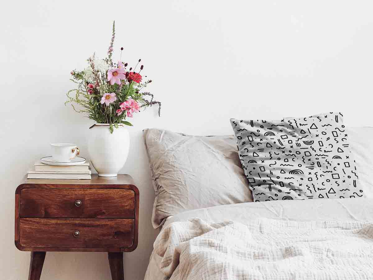 Coussin de santé blanc avec formes en noir