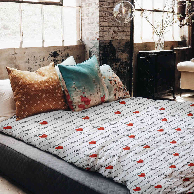 Therapy blanket bedding set, white with "Love" lettering.