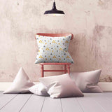 Health pillow, white with yellow triangles.