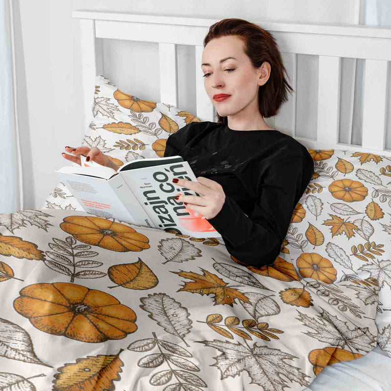 Therapy blanket bedding set, white with leaf and pumpkin pattern.