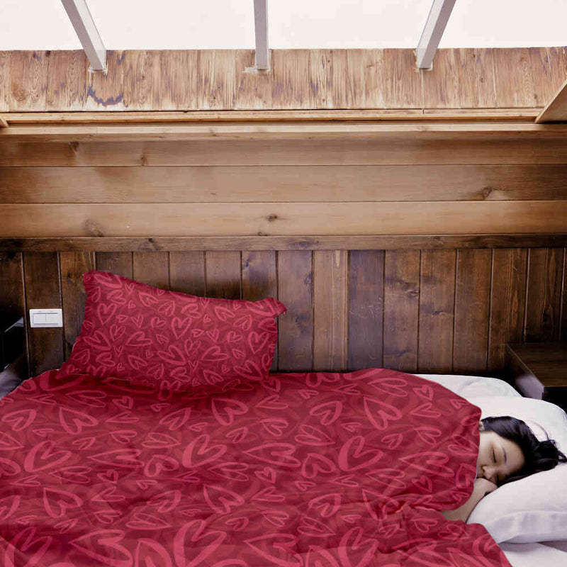Therapy blanket and bedding set, red with pink heart motif.