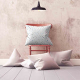 White health pillow with small blue shapes