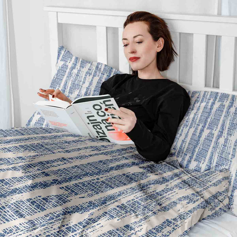 Therapy blanket and bedding set with blue pattern.