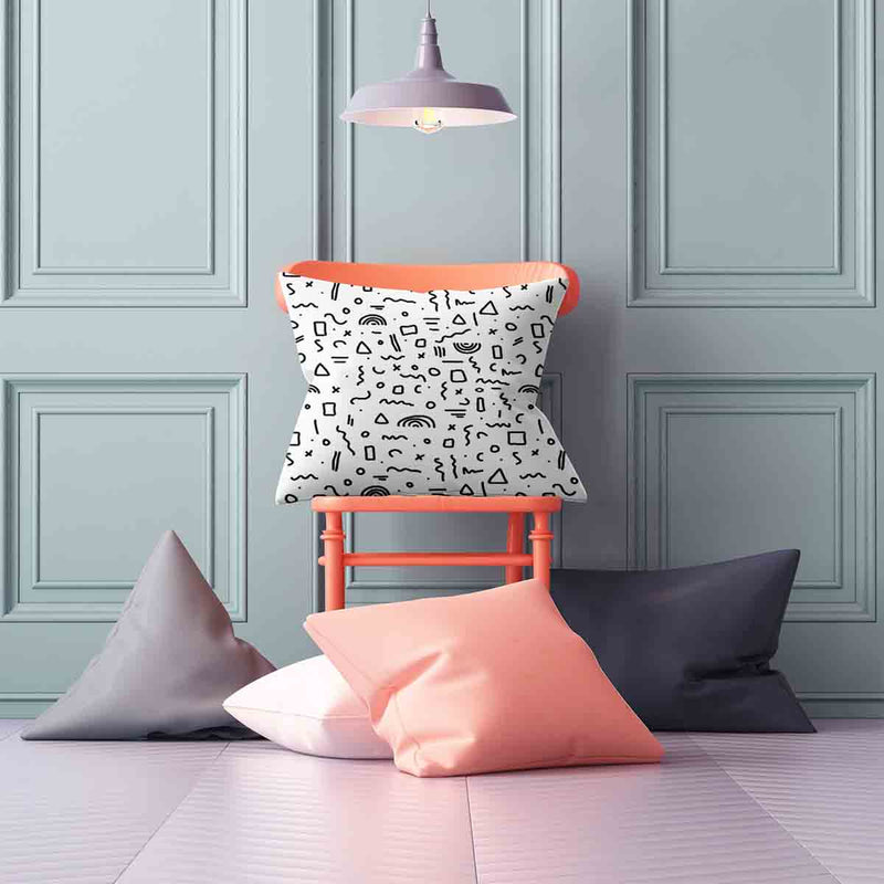 White health pillow with black shapes.