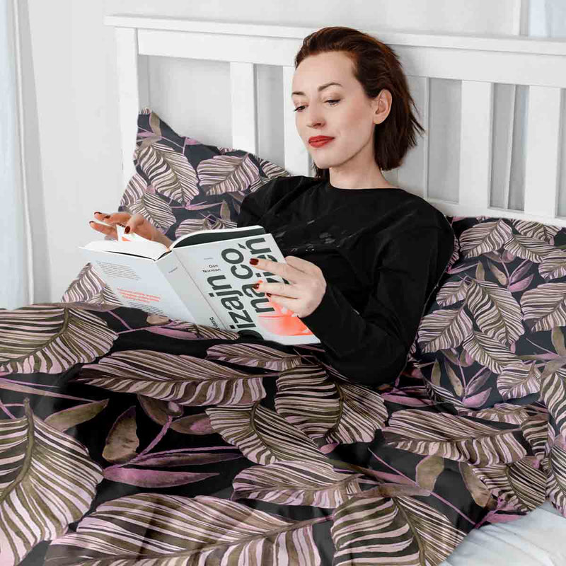 Therapy blanket and bedding set, black with purple leaves.
