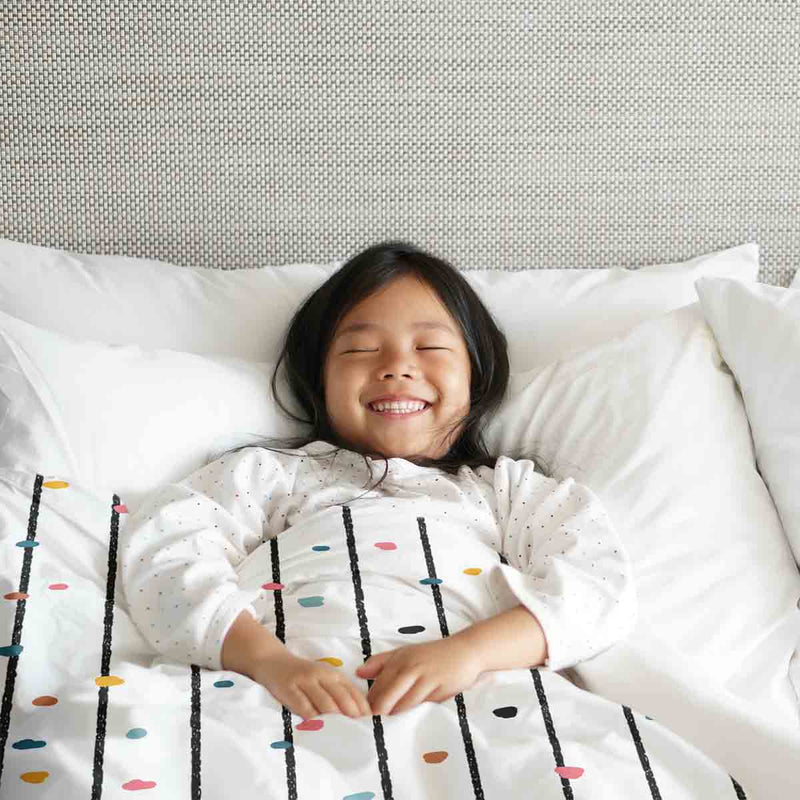 Therapy blanket and bedding set with colorful dots.