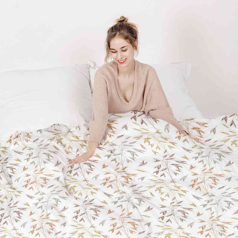 Therapy blanket and bedding set with delicate, colorful branches.
