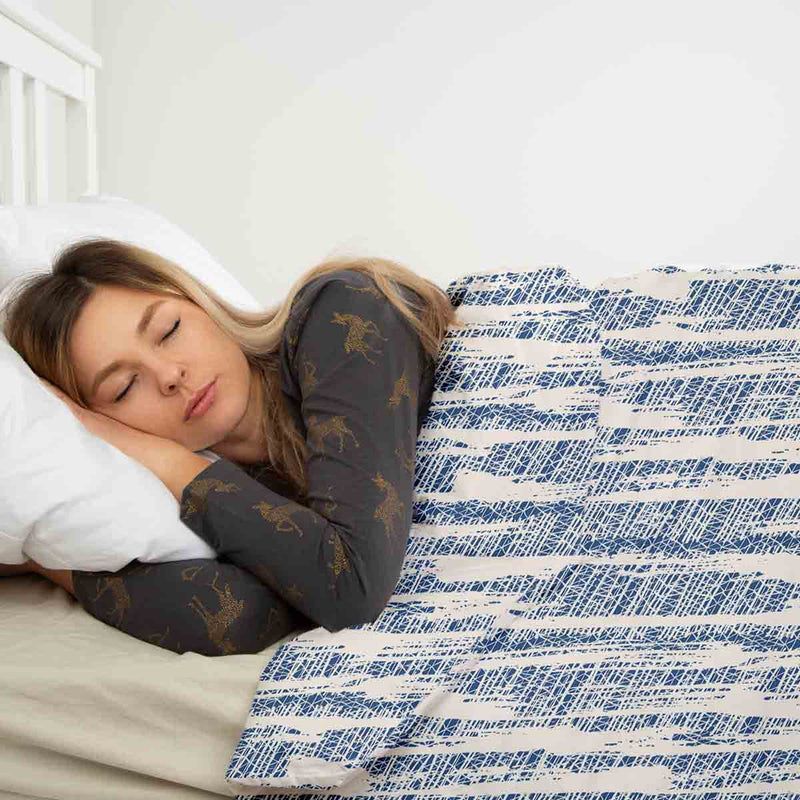 Therapy blanket and bedding set with blue pattern.