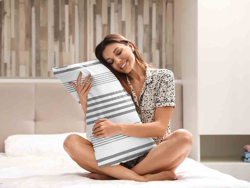 Health pillow, grey with thick and thin stripes.