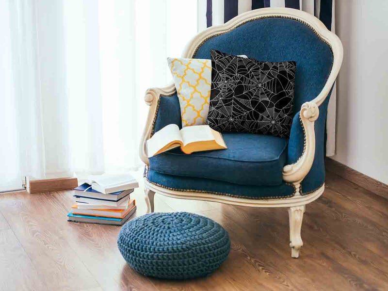 Health pillow, black with spiderweb pattern.