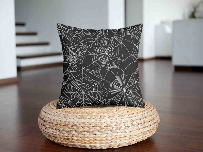 Health pillow, black with spiderweb pattern.