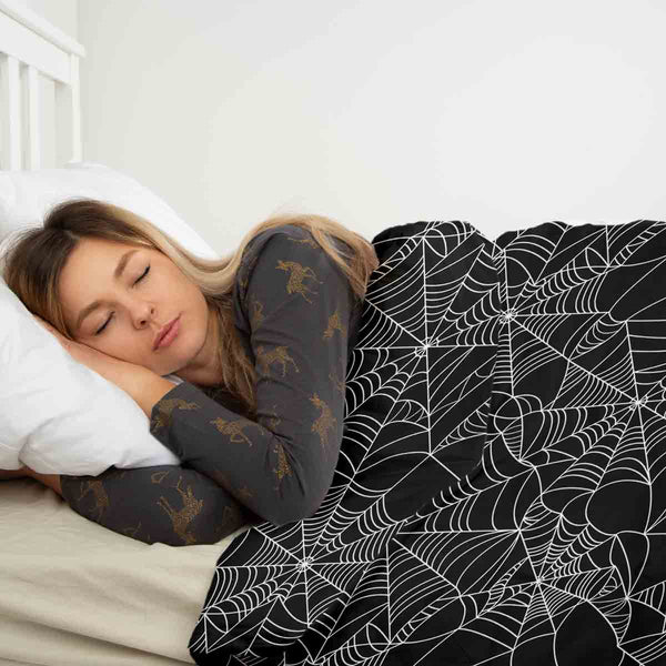Therapy blanket bedding set, black with spiderweb pattern.