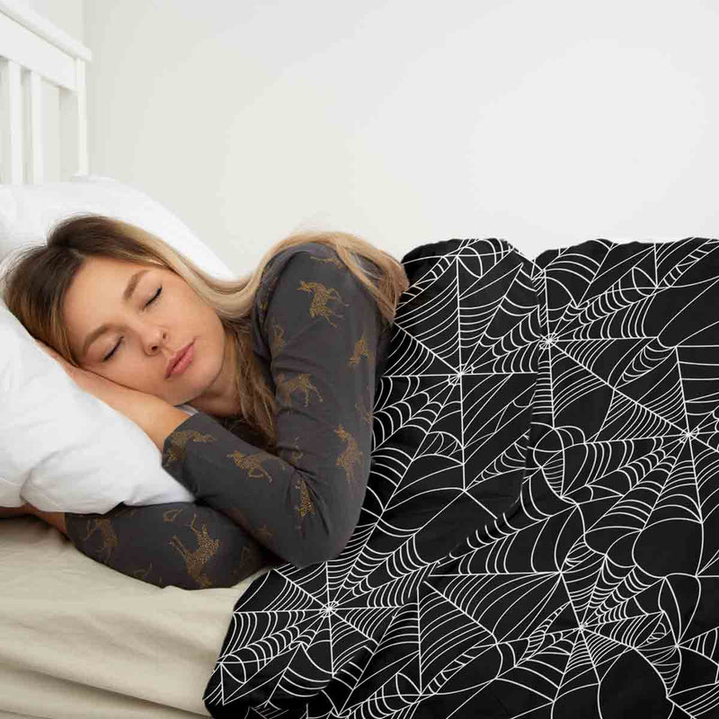 Therapy blanket bedding set, black with spiderweb pattern.