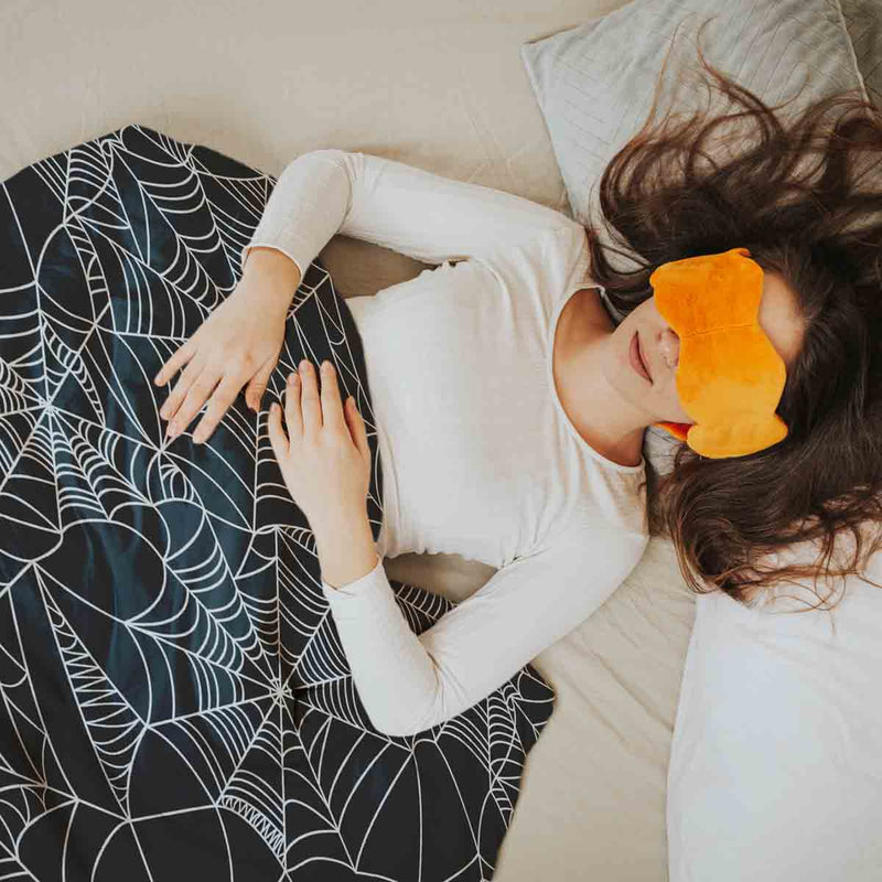 Therapy blanket bedding set, black with spiderweb pattern.