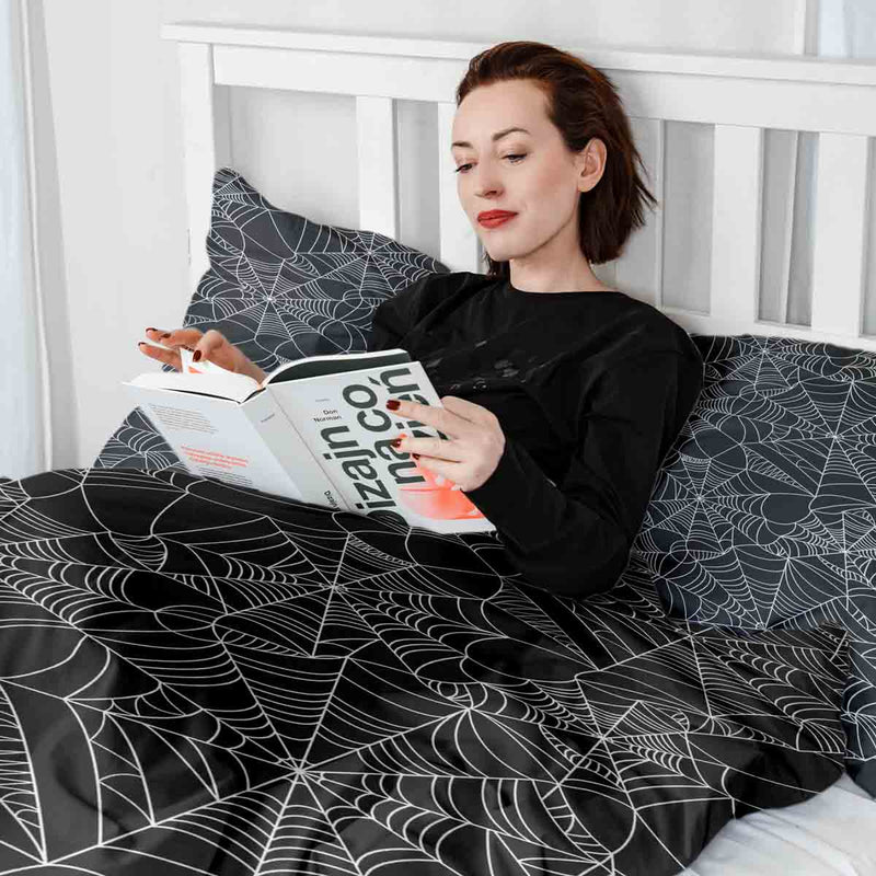 Therapy blanket bedding set, black with spiderweb pattern.